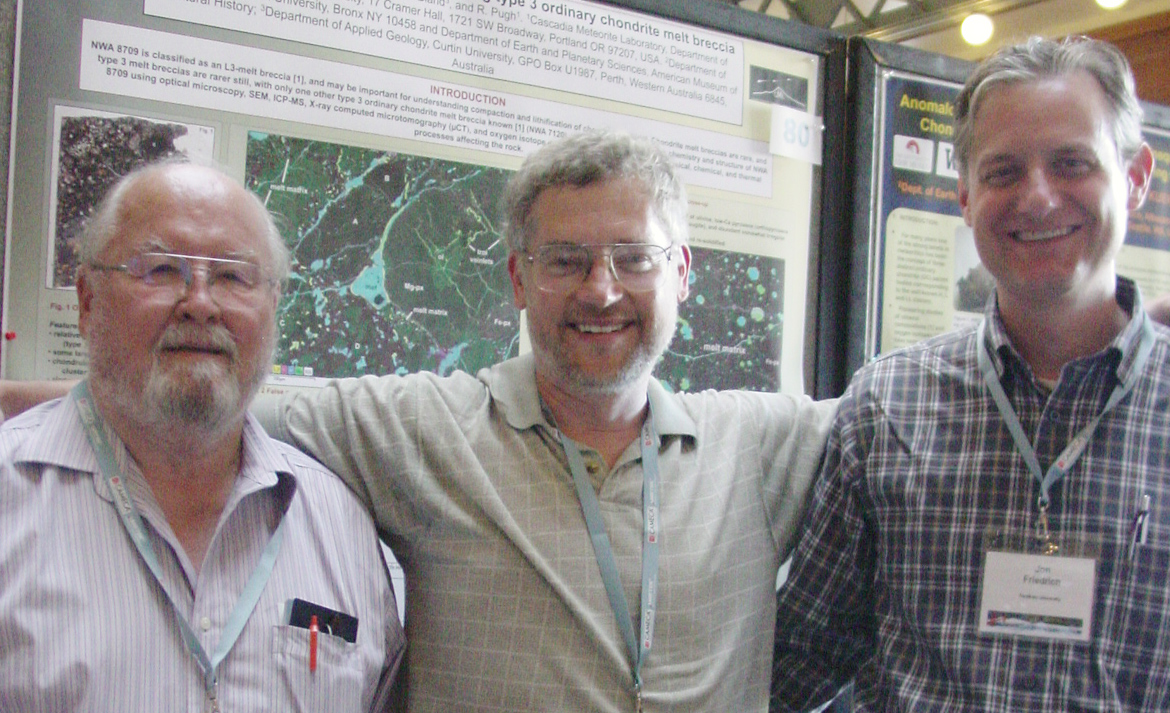 Dick, Alex, Jon Friedrich in front of poster